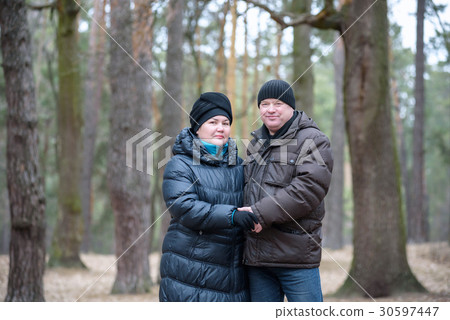 Old couple walking in the forest 30597447