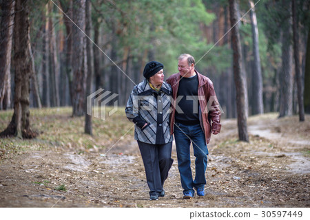 Old couple walking in the forest 30597449