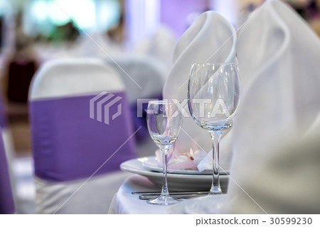 Glasses, forks, knives, table served restaurant. Glasses, forks, knives, table served restaurant. 30599230