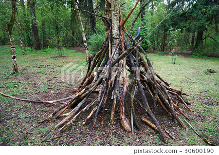 A hut of twigs in the forest. Nature, survival A hut of twigs in the forest. Nature, survival 30600190