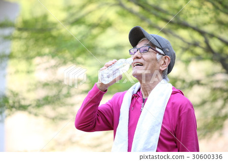Elderly men drinking water of PET bottles between outdoor exercise 30600336
