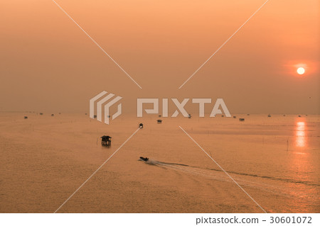 Hut and fishing boat on the sea in Thailand. 30601072