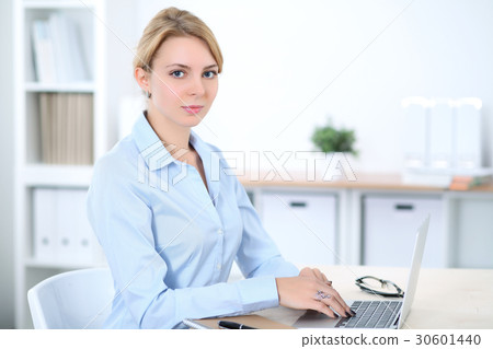 Young blonde business woman with laptop in the Young blonde business woman with laptop in the 30601440