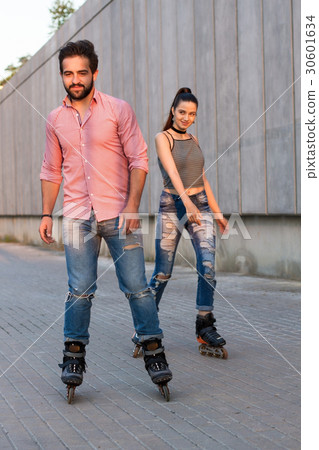 Couple inline skating. Couple inline skating. 30601634