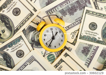 Alarm clock and dollars. Alarm clock and dollars. 30602129