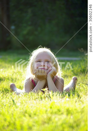 Carefree joyful little girl on grass 30602146