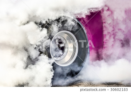 Drag racing car burns tires for the race Drag racing car burns tires for the race 30602183