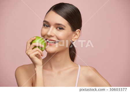 Enjoying fresh fruit 30603377