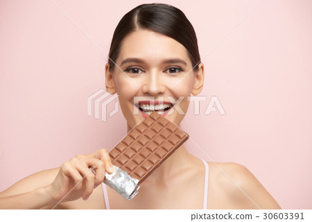 Enjoying chocolate 30603391