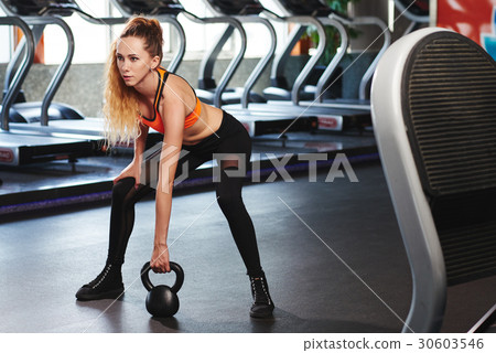 Lifting kettlebell Lifting kettlebell 30603546