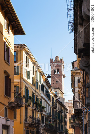 view of tower through street in Verona city 30604801