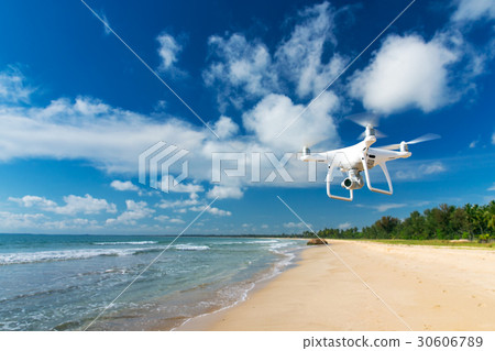 drone flying over sea. drone flying over sea. 30606789