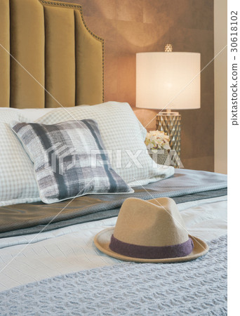 Luxury bedroom with decorative hat on bed Luxury bedroom with decorative hat on bed 30618102