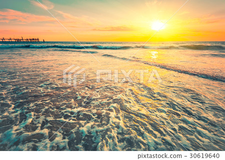 Waves at sunset on a warm evening Waves at sunset on a warm evening 30619640