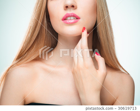The sensual red lips, mouth open, white teeth. The sensual red lips, mouth open, white teeth. 30619713