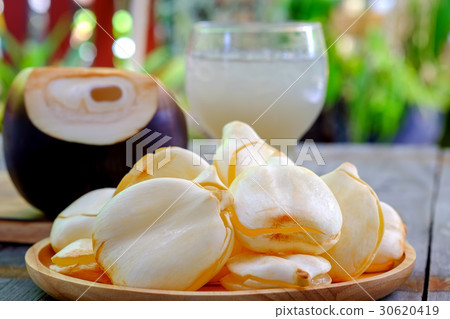 Toddy Palm,Palm juice with ice in wood tray. Toddy Palm,Palm juice with ice in wood tray. 30620419