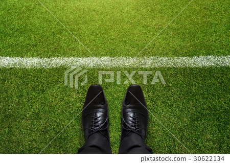 Business Challenge concept, Shoes in soccer field Business Challenge concept, Shoes in soccer field 30622134
