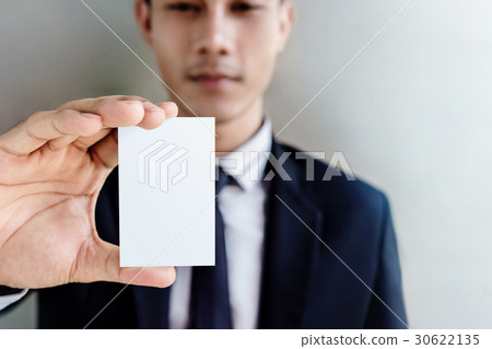 Businessman holding business card, clipping path Businessman holding business card, clipping path 30622135