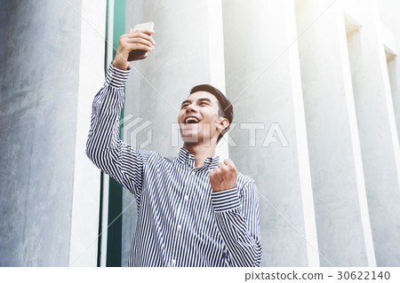 Happy Young Businessman in cheerful posture 30622140