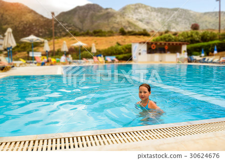 Girl in swimsuit swimming in pool, Bali, Crete 30624676