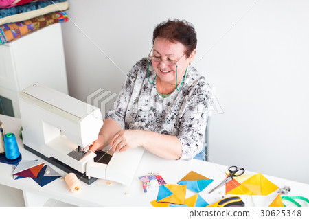 patchwork and quilting in the workshop of a tailor 30625348