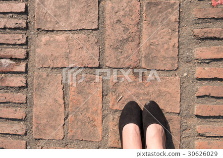 Brick Floor texture. Pavement patio woman's feet. 30626029