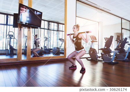 Pretty young woman training in the gym Pretty young woman training in the gym 30626174