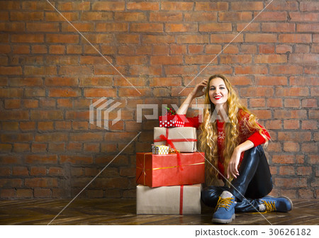 Young woman with Christmas gift Young woman with Christmas gift 30626182