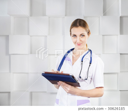 Female doctor with tablet computer Female doctor with tablet computer 30626185