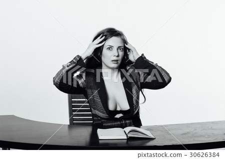 Sexy business woman shocked and looks in notebook Sexy business woman shocked and looks in notebook 30626384