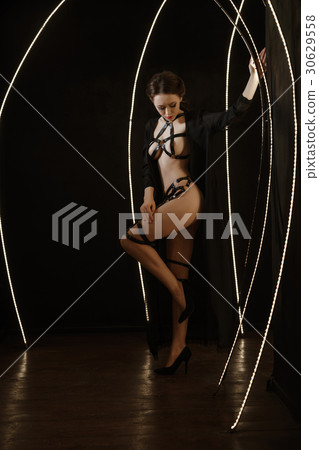 Nude woman in leather fetish lingerie, full length 30629558