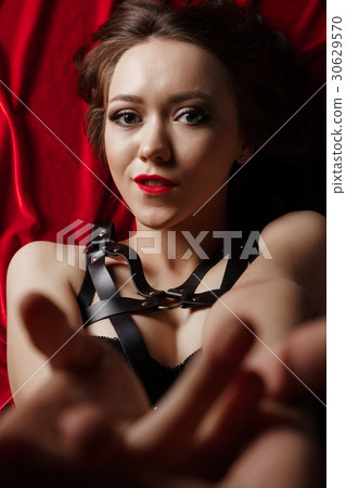 Submissive woman in leather bdsm fetish lingerie Stock Photo