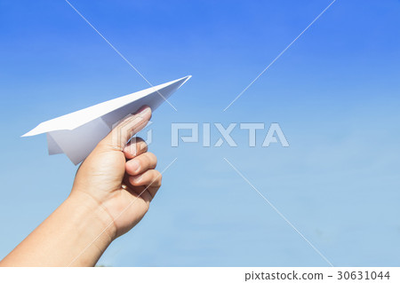 Hand holding rocket paper with blue sky. concept f 30631044