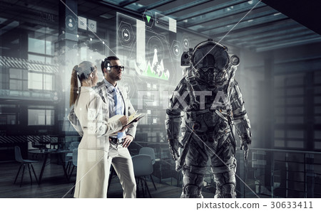 Scientists designing space suit. Mixed media Scientists designing space suit. Mixed media 30633411