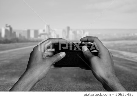 Man with camera in hands Man with camera in hands 30633483