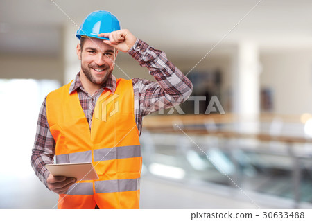 Smiling worker with digital tablet Smiling worker with digital tablet 30633488