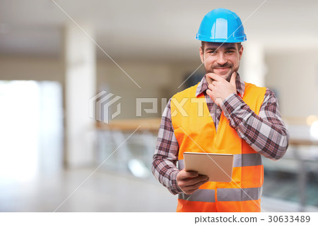 Manual worker with digital tablet Manual worker with digital tablet 30633489