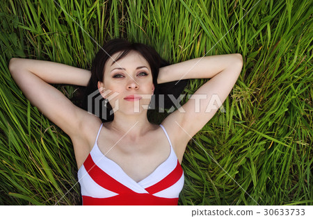 Brunette girl in summer field Brunette girl in summer field 30633733