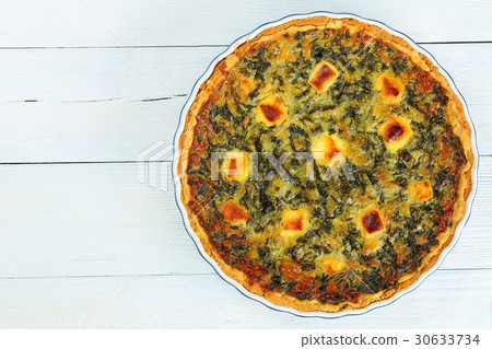 spring golden brown tart in baking dish 30633734
