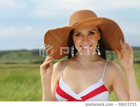 Smiling brunette girl summer day Smiling brunette girl summer day 30633735