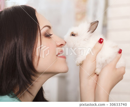 Woman holding little cute rabbit, close up 30633740