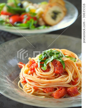 Cappellini lunch image of cold tomato image black background 30635316
