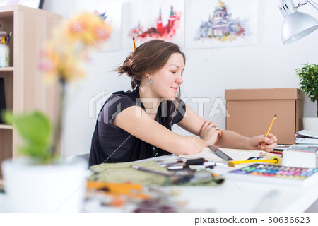 Young female artist drawing sketch using 30636623