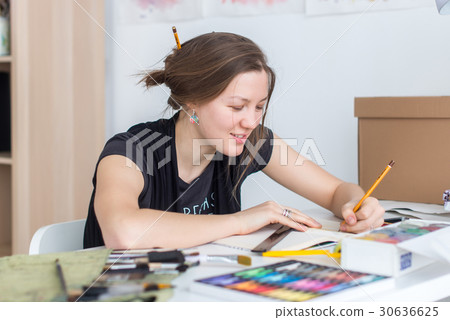 Young female artist drawing sketch using 30636625