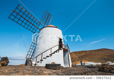 Windmill in cactus garden in Guatiza village Windmill in cactus garden in Guatiza village 30637022
