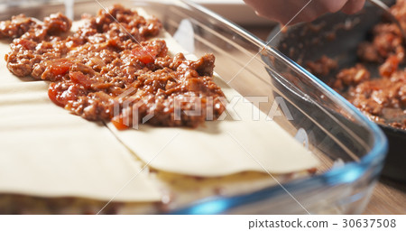 preparing traditional italian lasagna adding 30637508