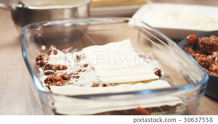 preparing traditional italian lasagna adding pasta 30637558