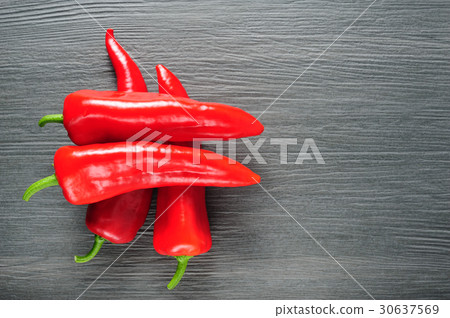 Sweet red Kapia peppers on a dark shale stone 30637569