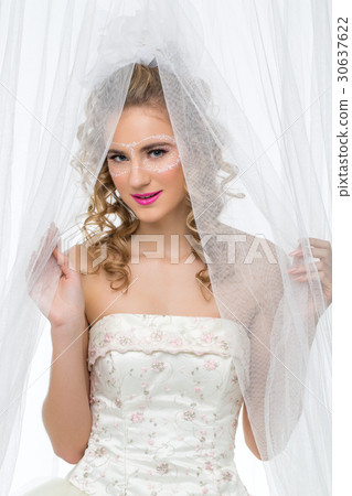 Bride with mask drawn on face Bride with mask drawn on face 30637622