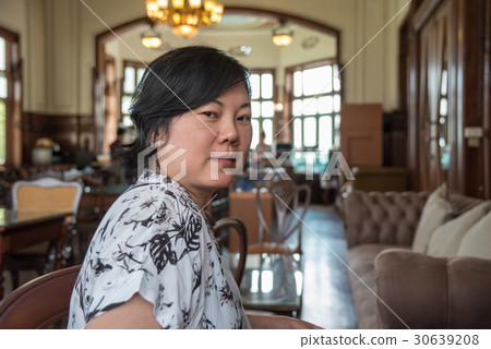 Asian women smile in coffee shop vintage style Asian women smile in coffee shop vintage style 30639208